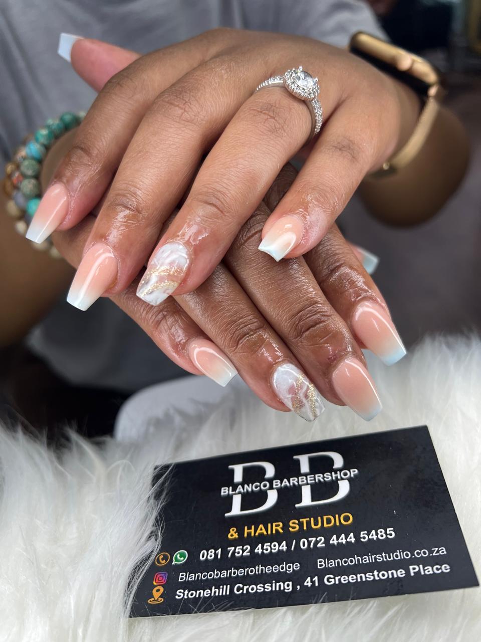 Baby blue French tips with marble accent nail