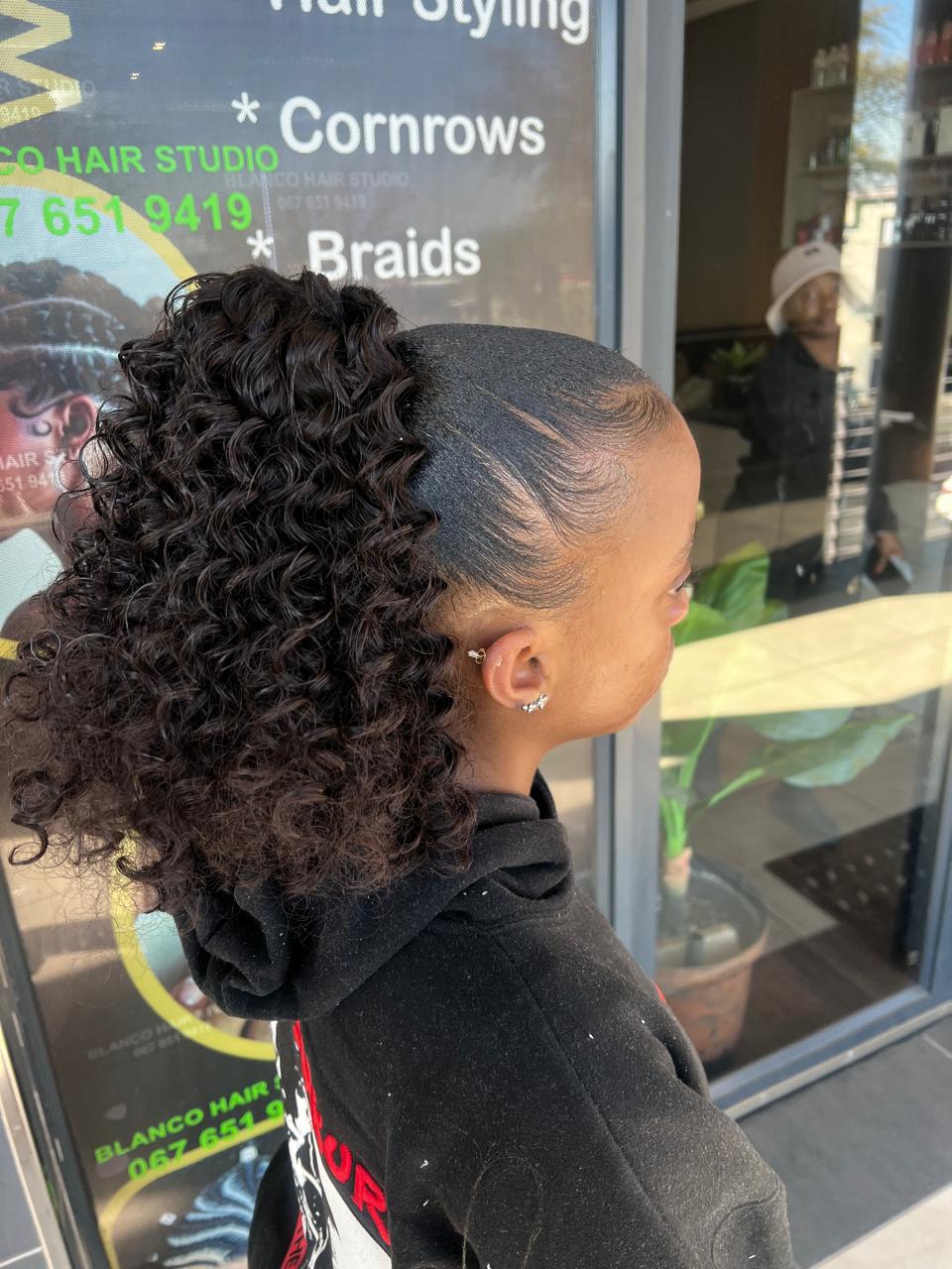 Curly ponytail with sleek edges