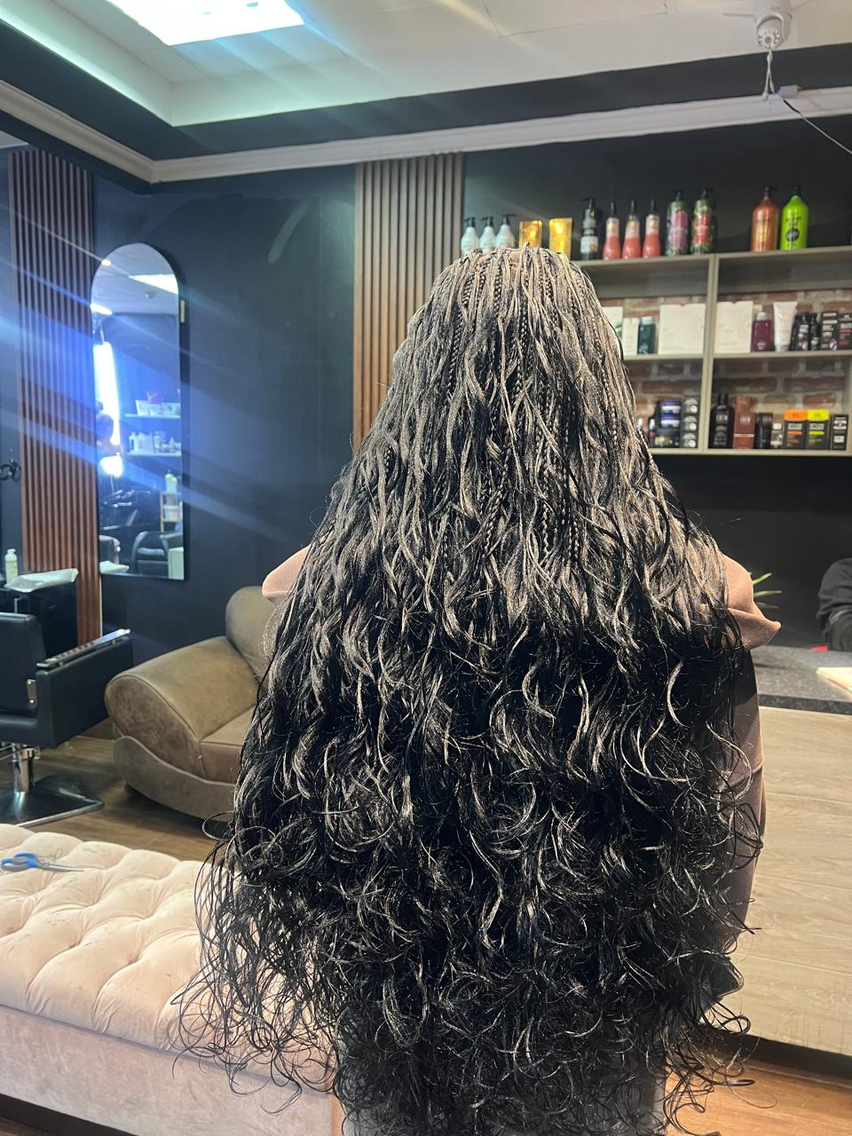 Long highlighted curly braids